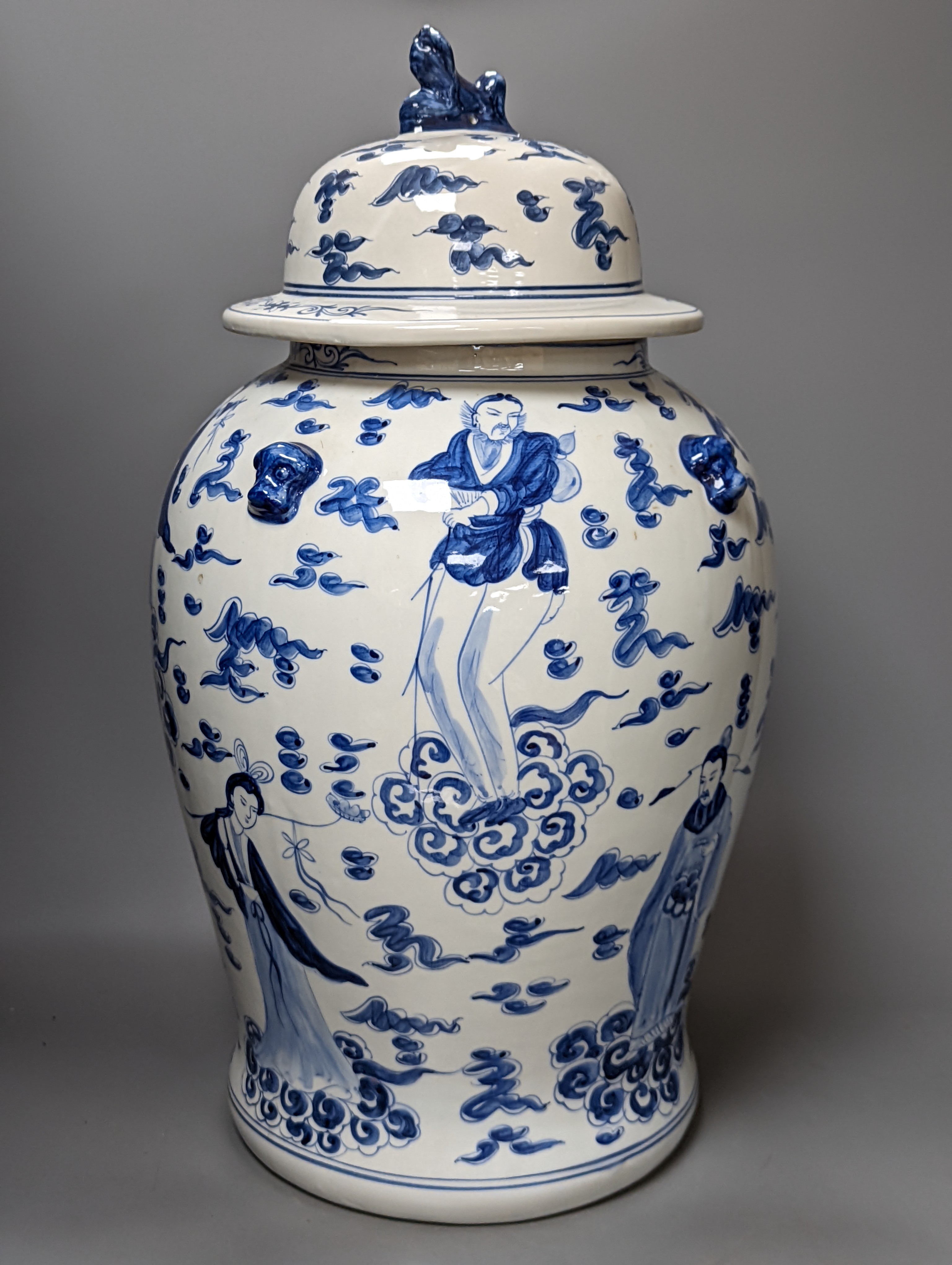 A large Chinese blue and white baluster jar and cover and matching vase, tallest 55 cms high.